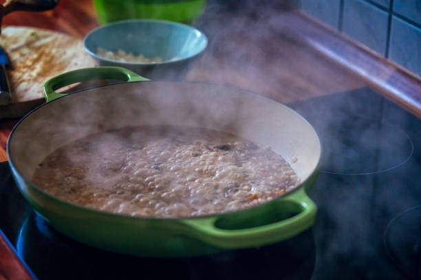 istock Preparing Risotto with Chanterelle Mushrooms and Parmesan 801664294
