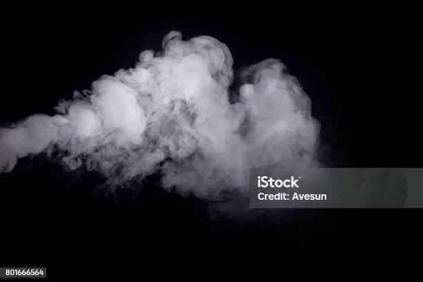 Abstract White Smoke Against Dark Background Stock Photo - Download Image Now - Smoke - Physical Structure, Electronic Cigarette Smoke, Black Background