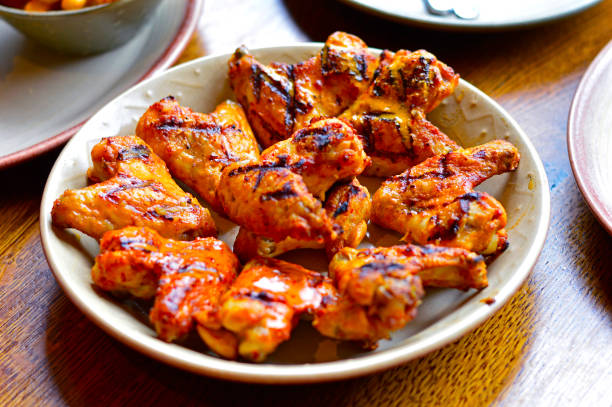 The Grilled Chicken Wings Placed on A Dining Table.