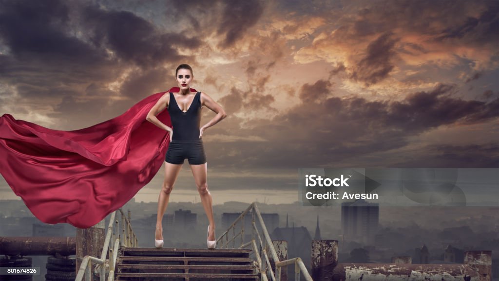 Super woman with red cape Portrait of young hero woman with super person red cape Women Stock Photo
