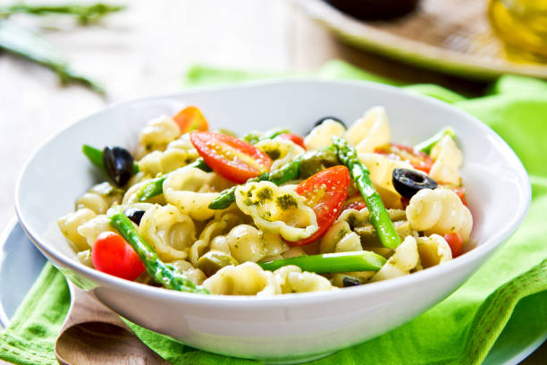 istock Gnocchi with Asparagus and Olive salad in Pesto dressing 801674836