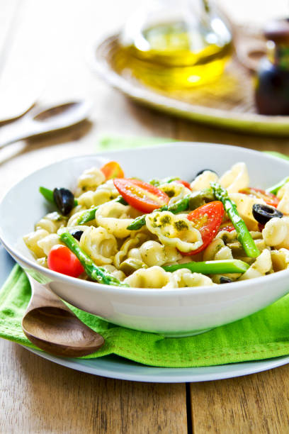 istock Gnocchi with Asparagus and Olive salad in Pesto dressing 801674902