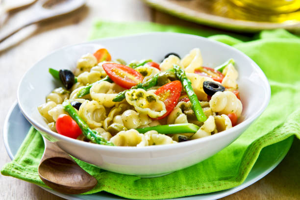 istock Gnocchi with Asparagus and Olive salad in Pesto dressing 801674908