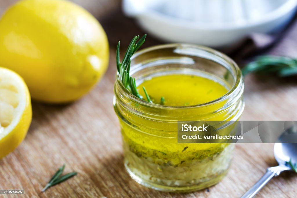 Rosemary and Garlic Lemon Vinaigrette Rosemary and Garlic Lemon Salad Dressing by fresh ingredients Cooking Stock Photo