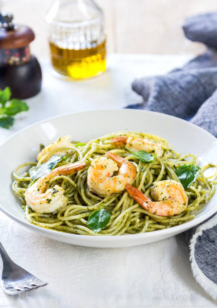 istock Spaghetti with Prawn in homemade Pesto sauce 801693644