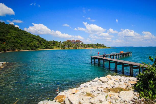istock Turquoise sea and wooden pier bridge 801696176