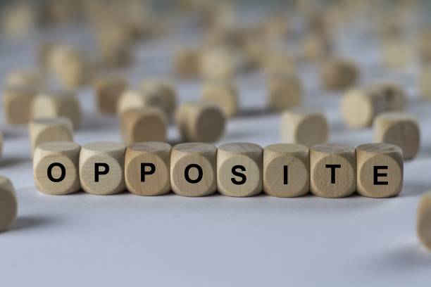 istock opposite - cube with letters, sign with wooden cubes 801703364