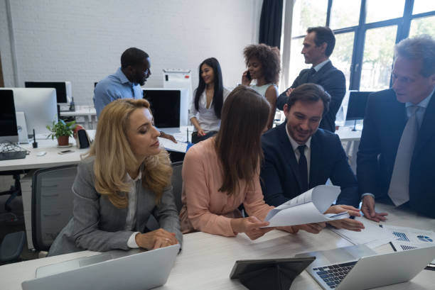 istock Business People Discussing Documents Working Together In Modern Office, Partners, Businesspeople Sharing Ideas 801703672