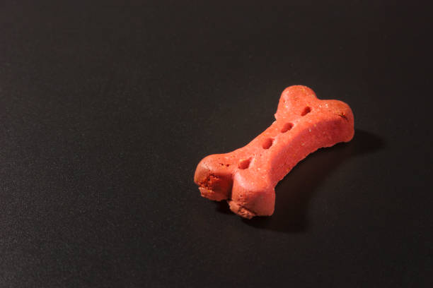 istock Dog cookies on a black background 801703898
