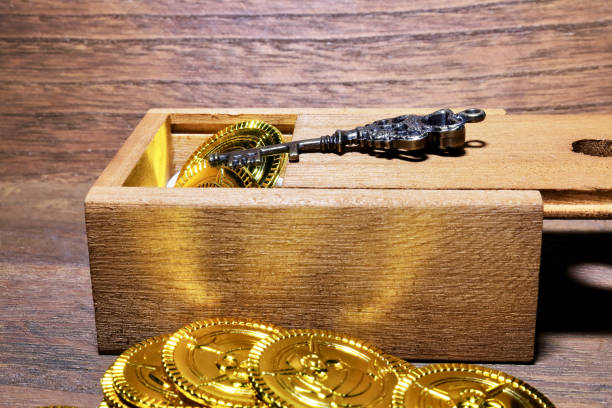 istock Toy gold coins and wood box 801709130