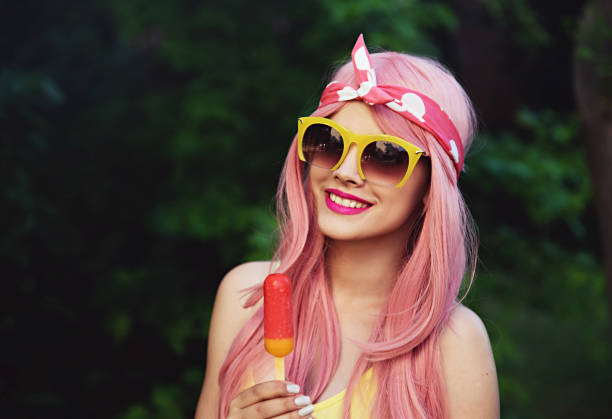 Portrait of pinup girl holding ice cream and smiling