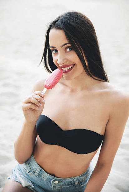 istock Brunette girl eating ice cream 801725792