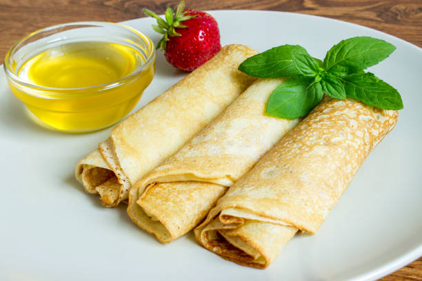 istock Crepes with strawberries with honey 801735866