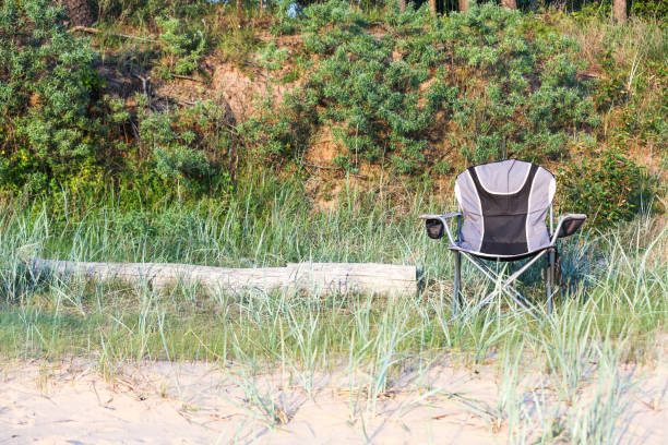 istock Chair by the beach in summer sunset 801738662
