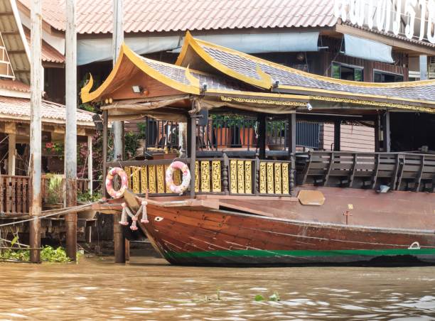 istock Thai Taxi Boat On Riverside Restaurant Background. 801740802