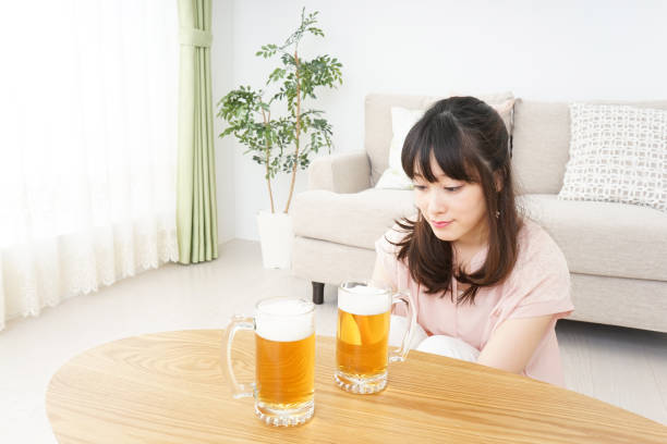 istock Young woman drinking beer 801741814