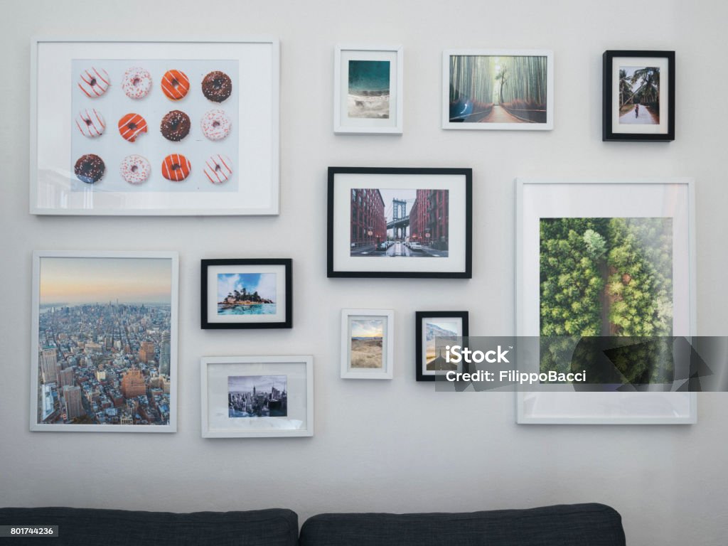 Home interior with sofa and paintings on the wall Wall - Building Feature Stock Photo