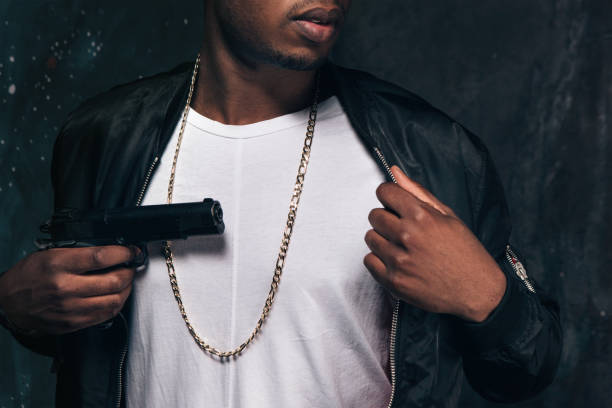 istock Unrecognizable black man threatens with a gun 801747778