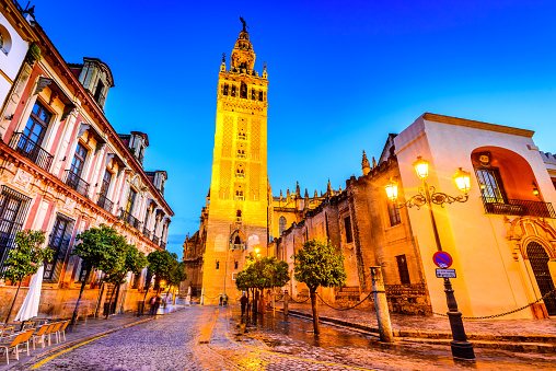Seville, Andalusia, Spain. Cityscape twilight image with Santa Maria de la Sede Cathedral and Girdala