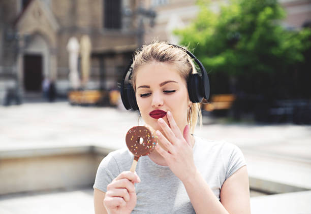 istock Blonde girl eating ice cream 801765120