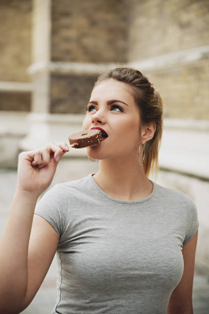 istock Girl eating chocolate ice cream 801765232