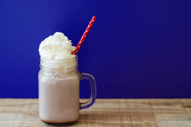 istock Hot chocolate with white whipped cream in a glass jar 801782724