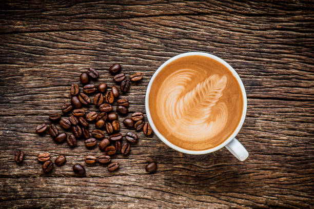 istock Coffee cup and coffee beans on wooden background 801782748