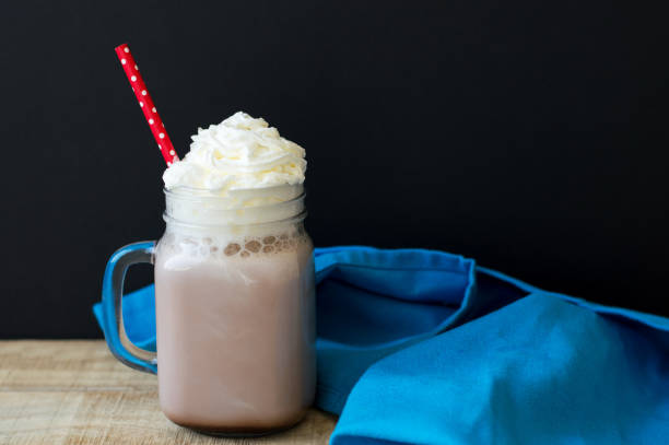 istock Hot chocolate with whipped cream topping and red straw 801782838