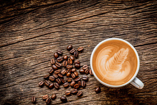 istock Coffee cup and coffee beans on wooden background 801782876