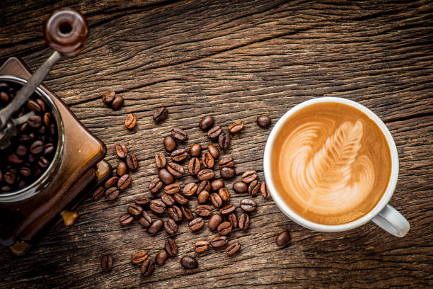istock Coffee cup and coffee beans on wooden background 801783044