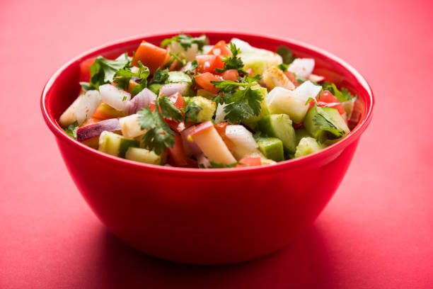 istock Kachumber or indian green salad served in red or white bowl, selective focus 801818728