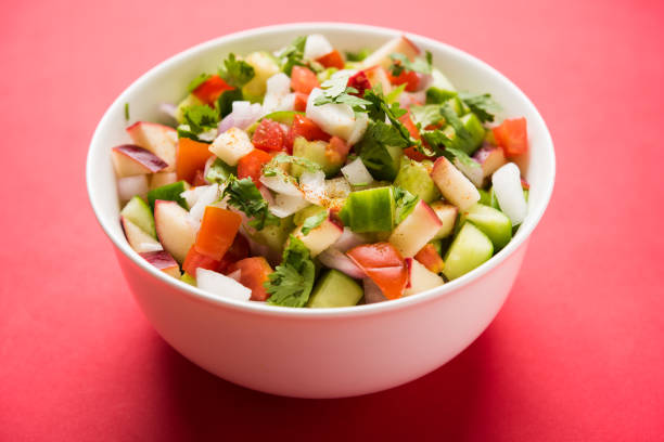 istock Kachumber or indian green salad served in red or white bowl, selective focus 801830514