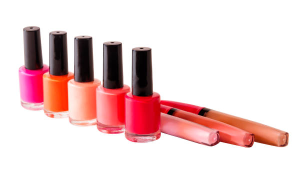 istock Group of nail polishes and lip glosses isolated. Selective focus 801830852