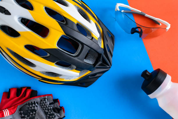 istock set bicycle equipment on a blue and orange paper background 801830998