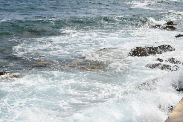 istock Large waves on the beach, due to strong winds 801840280