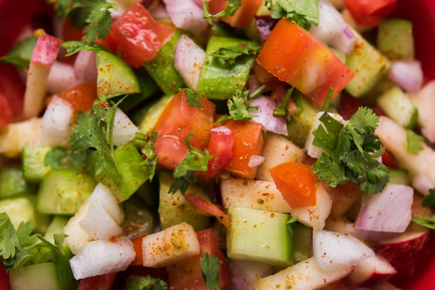 istock Kachumber or indian green salad served in red or white bowl, selective focus 801846092