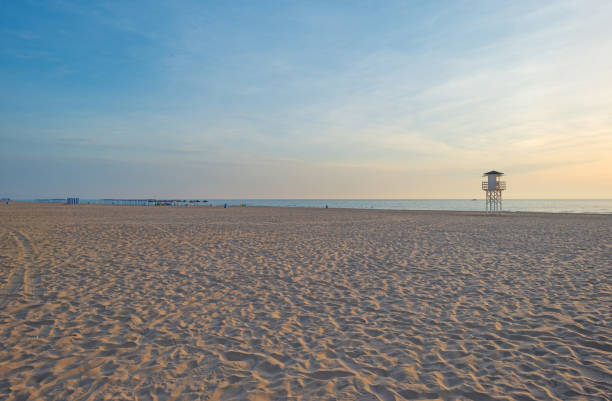 istock Sunrise over sea and sandy beach in spring 801847534