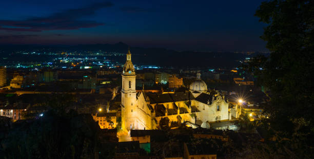istock Illuminated city seen from a hill at night 801847586
