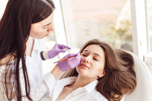 istock Correction and eyebrow styling in salon 801850490