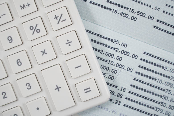 istock Close up of white calculator on statements background. 801850730
