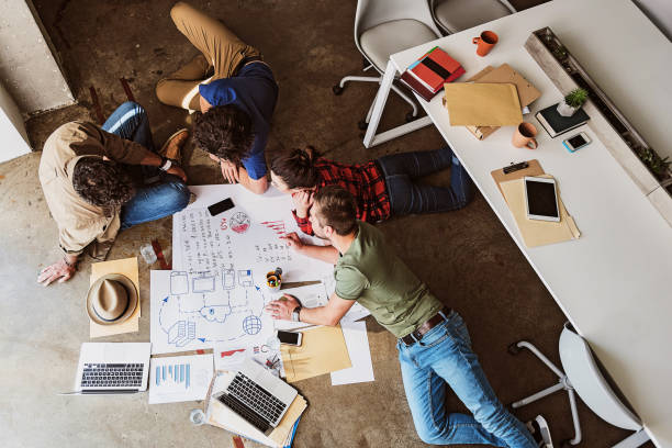 istock Cheerful young coworkers planning new project 801852988