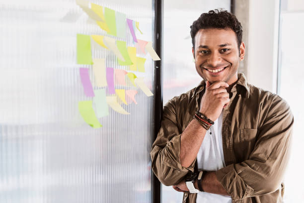 istock Pensive male freelancers working with joy 801853556