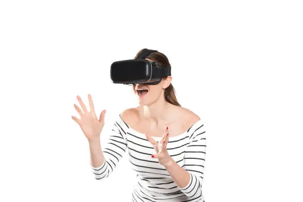 A woman trying a Virtual Reality Headset on white background