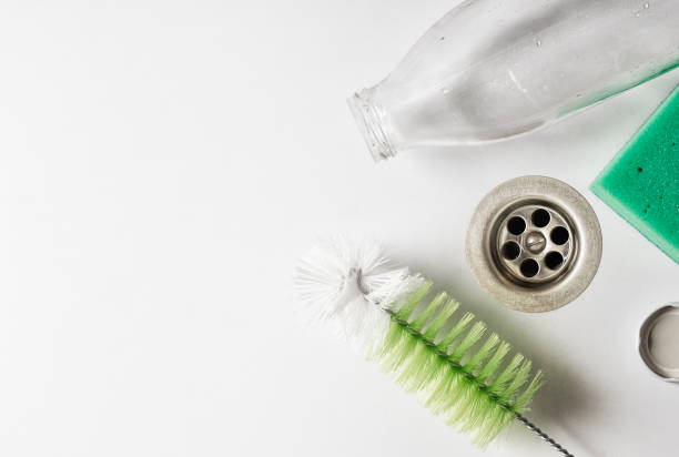 A bottle of milk in the sink while washing