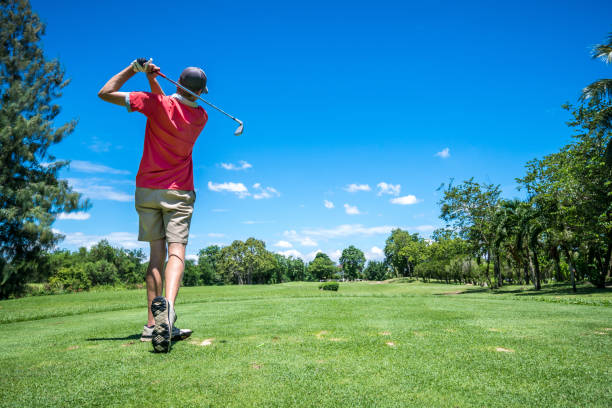 istock golfer tee off with golf club 801892654