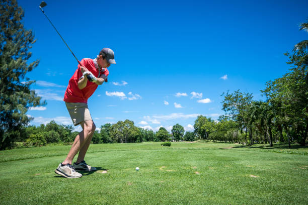 istock golfer tee off with golf club 801892830