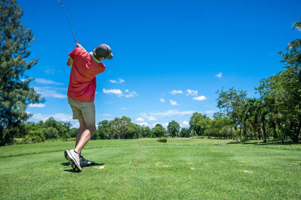 istock golfer tee off with golf club 801892894