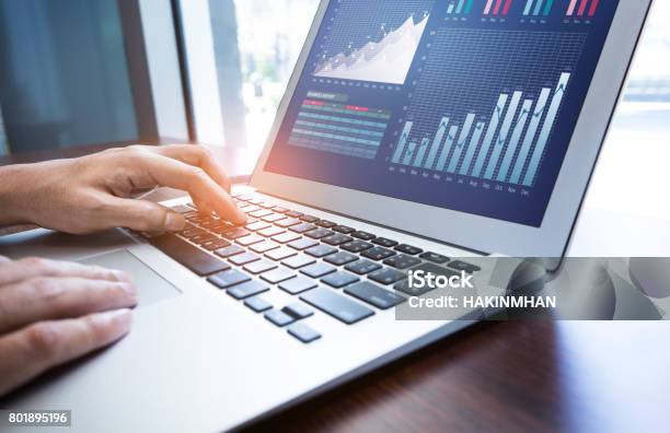 Young Businessman Multitasking Using Laptopworking Concepts Stock Photo - Download Image Now