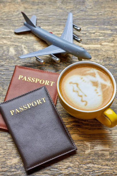 istock Coffee, passports and toy airplane. 801898474