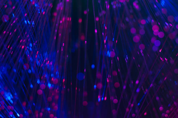 istock defocused abstract fiber optics lights background 801902762